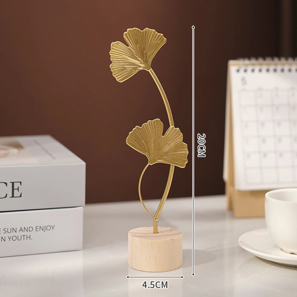 Escultura de folhas douradas para decoração